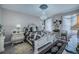Elegant main bedroom with ornate bed frame and large windows at 25533 Heritage Lake Blvd # 19, Punta Gorda, FL 33983