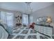Main bedroom with large bed, dresser, and access to balcony at 25533 Heritage Lake Blvd # 19, Punta Gorda, FL 33983