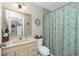 Simple bathroom with shower/tub combo and updated vanity at 27251 Adams St # 212, Punta Gorda, FL 33983