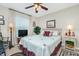 Cozy bedroom with a queen-size bed and ceiling fan at 27251 Adams St # 212, Punta Gorda, FL 33983