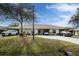 Two-unit condo building with carport parking and nicely landscaped grounds at 27251 Adams St # 212, Punta Gorda, FL 33983