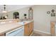 Clean kitchen showcasing a white sink and light wood cabinets at 27251 Adams St # 212, Punta Gorda, FL 33983