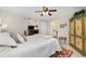 Bright main bedroom with a king-size bed and plenty of closet space at 27251 Adams St # 212, Punta Gorda, FL 33983