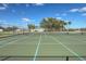 Well-maintained tennis court with surrounding fence at 27251 Adams St # 212, Punta Gorda, FL 33983