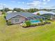 Home's backyard features a screened pool and lush landscaping at 287 Fortaleza St, Punta Gorda, FL 33983