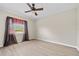 Bedroom with ceiling fan and window coverings at 287 Fortaleza St, Punta Gorda, FL 33983