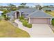 Single-story home with gray roof, attached garage, and landscaped yard at 287 Fortaleza St, Punta Gorda, FL 33983