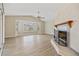 Spacious living room featuring a fireplace and wood-look floors at 287 Fortaleza St, Punta Gorda, FL 33983