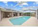 Large screened pool with surrounding patio furniture at 287 Fortaleza St, Punta Gorda, FL 33983