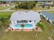 Aerial view of home with pool and surrounding landscape at 303 San Cristobal Ave, Punta Gorda, FL 33983