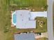 Bird's-eye view of single-Gathering home, pool, and driveway at 303 San Cristobal Ave, Punta Gorda, FL 33983