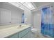 Clean bathroom with a light blue vanity and shower/tub combo at 303 San Cristobal Ave, Punta Gorda, FL 33983