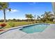 Inviting pool area with lush landscaping and tranquil water views at 303 San Cristobal Ave, Punta Gorda, FL 33983