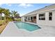 Refreshing pool with surrounding patio and a view of the home at 303 San Cristobal Ave, Punta Gorda, FL 33983