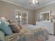 Bedroom with white dresser and bed with coastal decor at 3329 Purple Martin Dr # 121, Punta Gorda, FL 33950