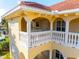 Close-up of building's second floor balcony with white railings at 3329 Purple Martin Dr # 121, Punta Gorda, FL 33950