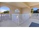 Stairwell with white railings and arched windows at 3329 Purple Martin Dr # 121, Punta Gorda, FL 33950