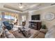 Open living room with fireplace and access to balcony at 3329 Purple Martin Dr # 121, Punta Gorda, FL 33950