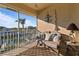 Peaceful screened balcony with water views and comfortable seating at 3329 Purple Martin Dr # 121, Punta Gorda, FL 33950