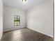 Bright bedroom with large window and tile floors at 3733 Basket St, North Port, FL 34288