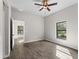 Bright bedroom with tile floors and large window at 3733 Basket St, North Port, FL 34288