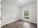 Simple bedroom with tile floors and window at 3733 Basket St, North Port, FL 34288