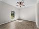 Bright bedroom with large window and tile flooring at 3733 Basket St, North Port, FL 34288