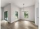 Bright dining area with tile flooring and a modern chandelier at 3733 Basket St, North Port, FL 34288