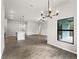 Dining room with modern chandelier, view of living room and kitchen at 3733 Basket St, North Port, FL 34288