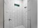 Clean shower with bright white tile at 3733 Basket St, North Port, FL 34288