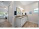 Elegant bathroom with double vanity and granite countertop at 3845 Bal Harbor Blvd, Punta Gorda, FL 33950