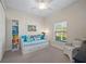 Bright bedroom featuring a daybed and built-in shelving at 3845 Bal Harbor Blvd, Punta Gorda, FL 33950