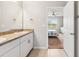 Double vanity bathroom with a view of a bedroom at 3861 Cobblestone Ln, Port Charlotte, FL 33980