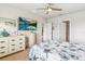 Main bedroom with large TV, dresser, and ensuite bathroom at 3861 Cobblestone Ln, Port Charlotte, FL 33980