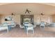 Covered patio area with tables and chairs at 3861 Cobblestone Ln, Port Charlotte, FL 33980