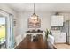 Dining room with dark wood table and white chairs at 3861 Cobblestone Ln, Port Charlotte, FL 33980