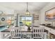 Bright dining room with lake view and coastal decor at 3861 Cobblestone Ln, Port Charlotte, FL 33980