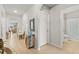 View of entryway with tile flooring, leading to living room and bathroom at 3861 Cobblestone Ln, Port Charlotte, FL 33980