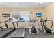 Fitness center with treadmills and elliptical machines at 3861 Cobblestone Ln, Port Charlotte, FL 33980