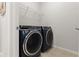 Laundry room with a washer and dryer set at 3861 Cobblestone Ln, Port Charlotte, FL 33980