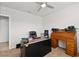 Home office with a wooden desk, comfortable chair, and built-in shelving at 3861 Cobblestone Ln, Port Charlotte, FL 33980