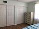 Spacious bedroom with double closets and wood-look floors at 4158 Tamiami Trl # B3, Port Charlotte, FL 33952