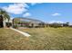 Landscaped backyard with canal views at 500 Belvedere Ct, Punta Gorda, FL 33950