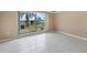 Spacious bedroom with large window and tile flooring at 500 Belvedere Ct, Punta Gorda, FL 33950