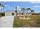 Single-story home with metal roof and palm trees at 500 Belvedere Ct, Punta Gorda, FL 33950