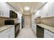 Modern kitchen with white cabinets and granite countertops at 500 Belvedere Ct, Punta Gorda, FL 33950