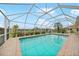 Inviting screened pool with paver deck at 500 Belvedere Ct, Punta Gorda, FL 33950