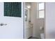 Small half bathroom with single sink and toilet at 5430 Almar Dr, Punta Gorda, FL 33950