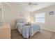 Bedroom with light blue bedding and window blinds at 5430 Almar Dr, Punta Gorda, FL 33950