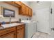 Laundry room with washer, dryer, and utility sink at 5430 Almar Dr, Punta Gorda, FL 33950